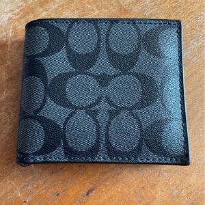 WORN black monogram COACH wallet